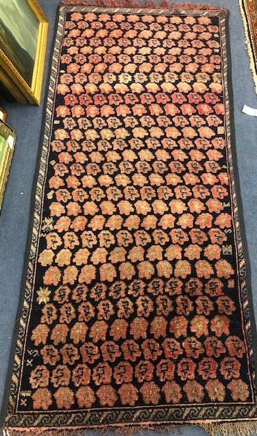 A Caucasian floral motif rug 177 x 84cm